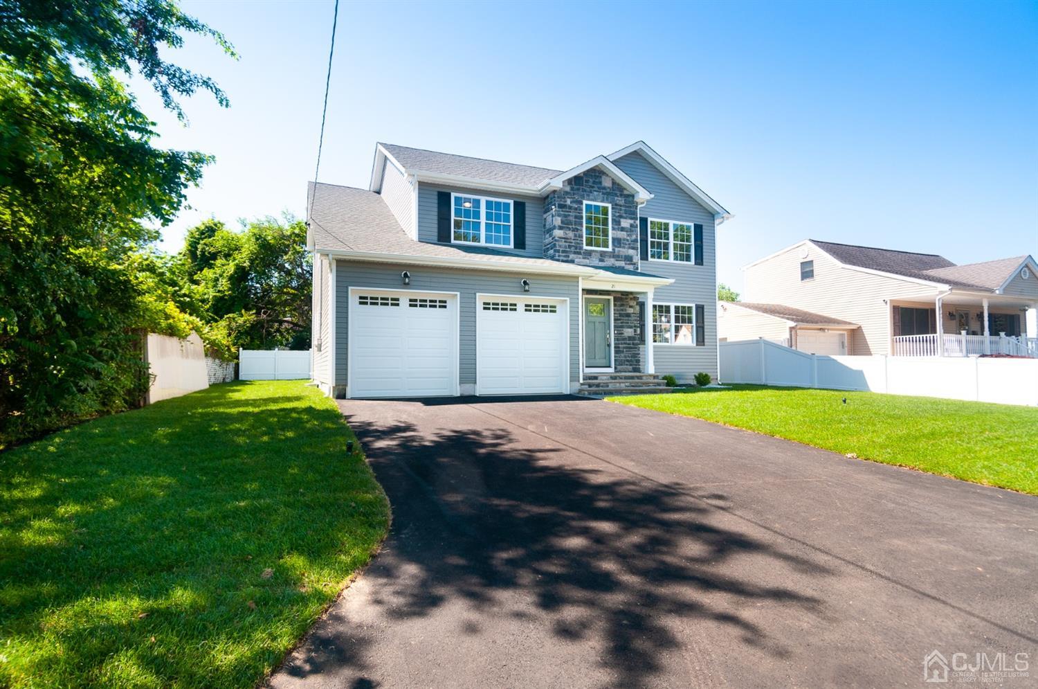 21 Stockton Road New Brunswick, NJ 08901 - Photo 41 of 45 a front view of a house with a yard and garage
