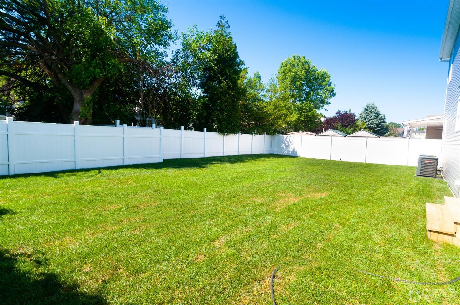 21 Stockton Road New Brunswick, NJ 08901 - Photo 45 of 45 a view of a back yard with a large tree
