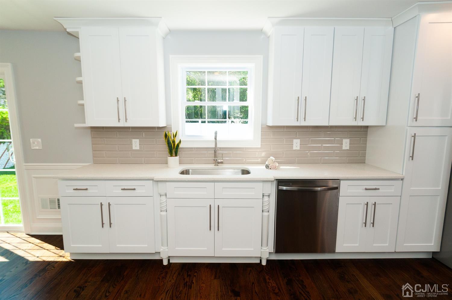 21 Stockton Road New Brunswick, NJ 08901 - Photo 6 of 45 a kitchen with white cabinets and sink