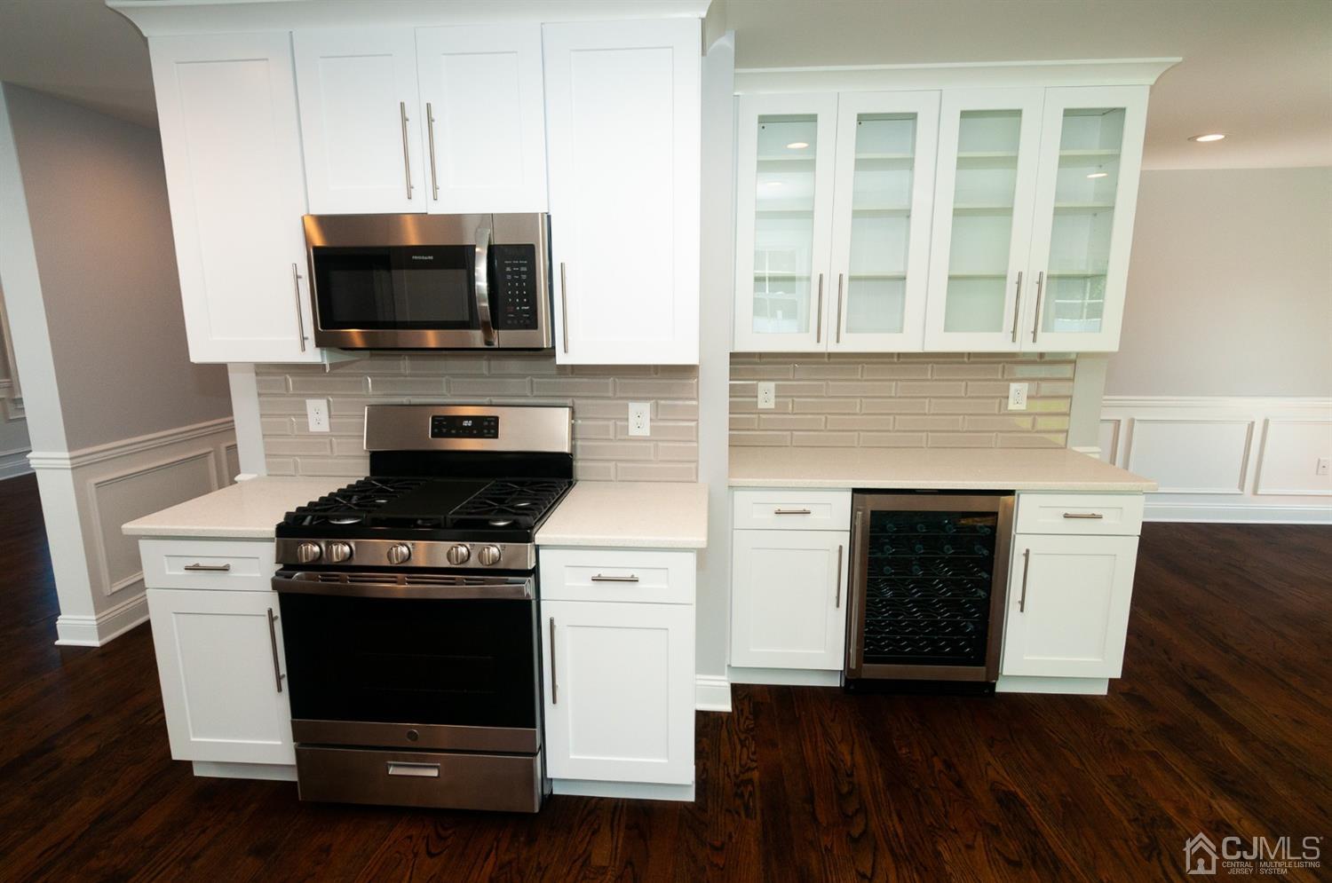 21 Stockton Road New Brunswick, NJ 08901 - Photo 10 of 45 a kitchen with stainless steel appliances a stove and a microwave