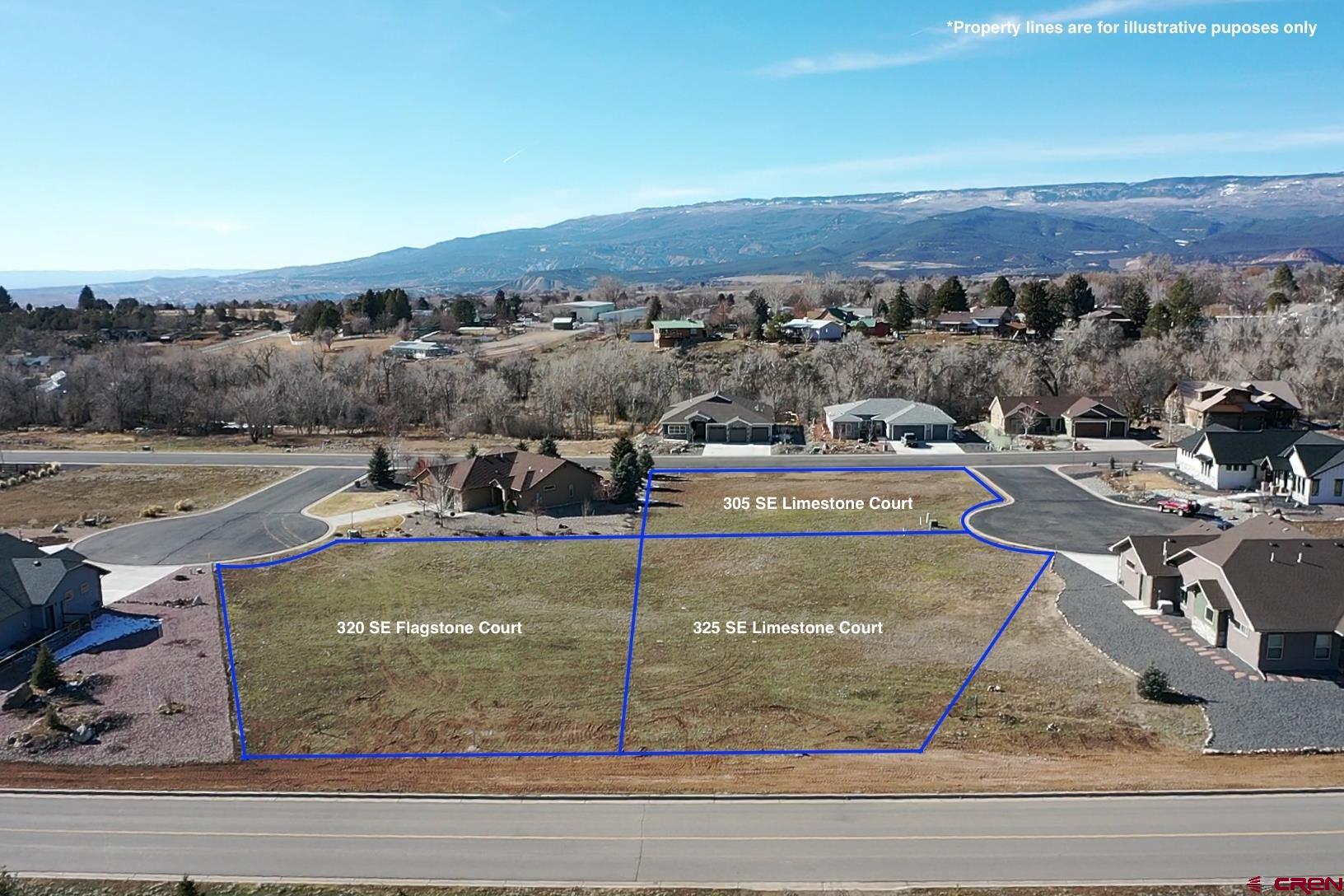 305 Southeast Limestone Court Cedaredge, CO 81413 - Photo 9 of 9 a view of a swimming pool with a yard