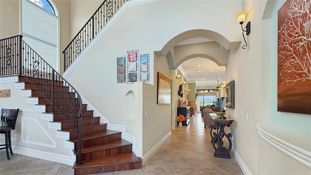 451 Muirfield Loop Reunion, FL 34747 - Photo 13 of 67 a view of entryway and hall with wooden floor