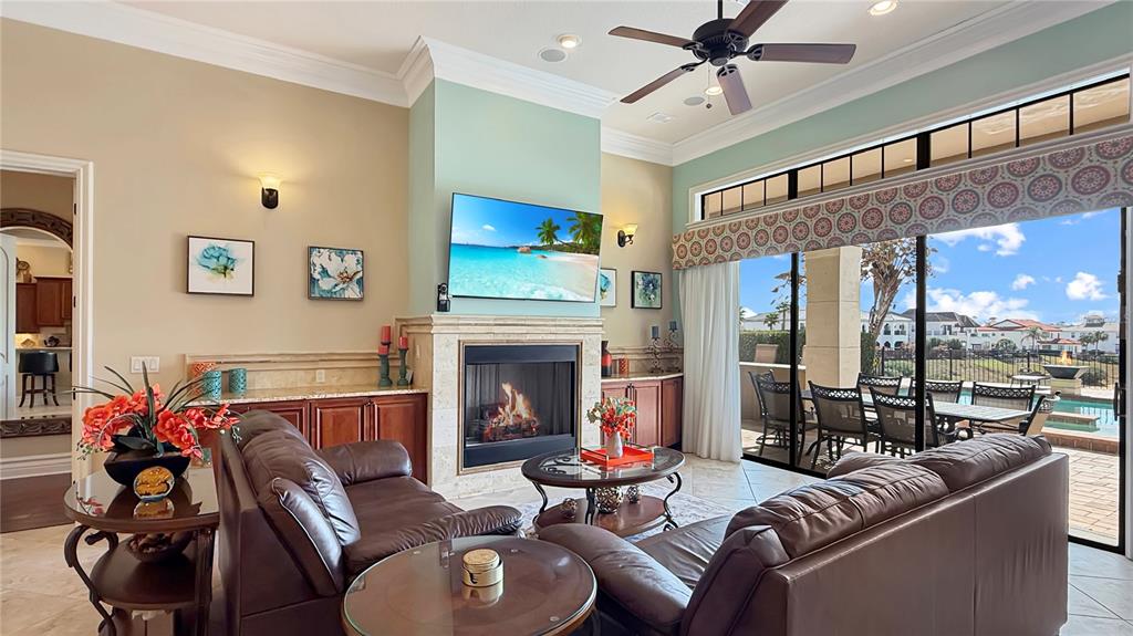 451 Muirfield Loop Reunion, FL 34747 - Photo 15 of 67 a living room with furniture and a fireplace