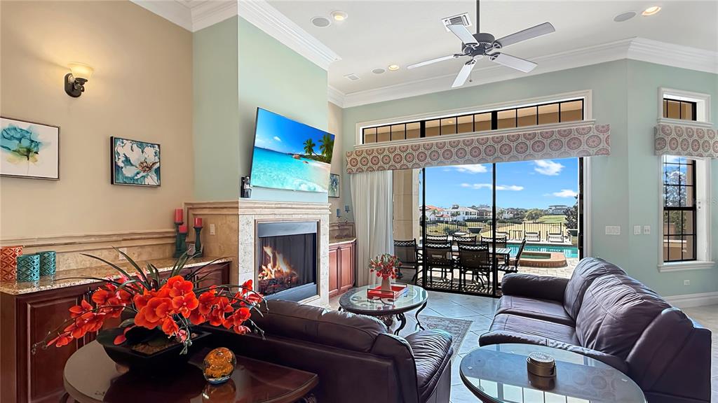 451 Muirfield Loop Reunion, FL 34747 - Photo 16 of 67 a living room with furniture fireplace and a large window