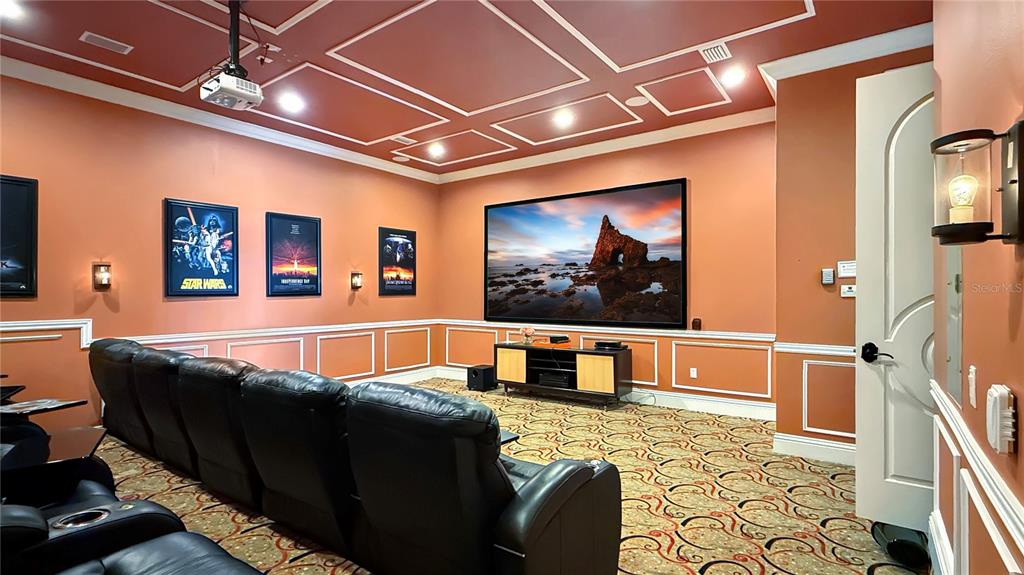 451 Muirfield Loop Reunion, FL 34747 - Photo 29 of 67 a living room with furniture a flat screen tv and a table