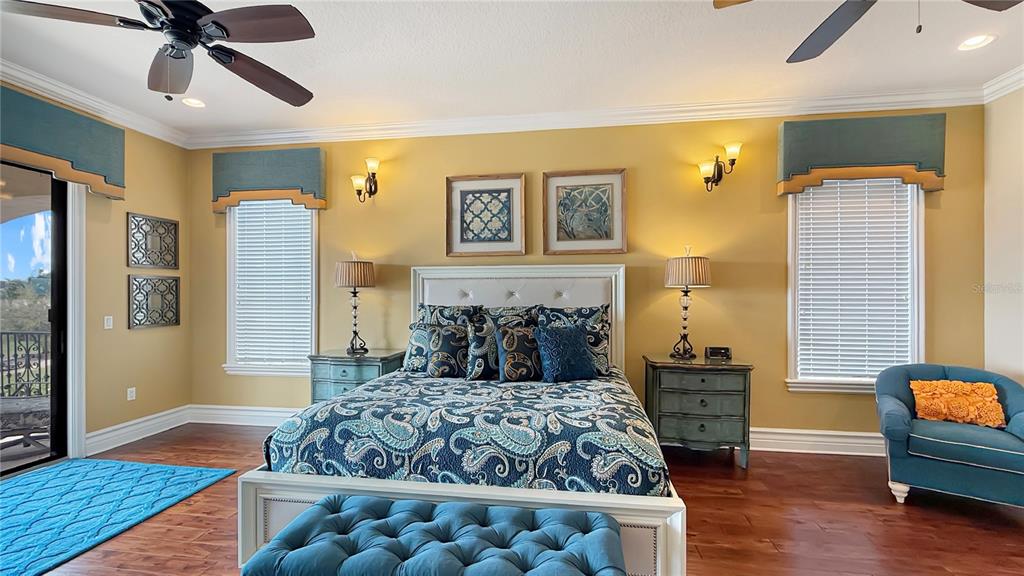 451 Muirfield Loop Reunion, FL 34747 - Photo 30 of 67 a bedroom with a large bed and a couch