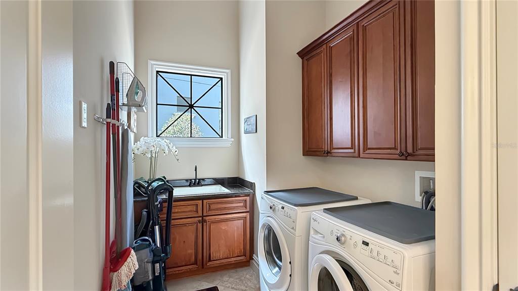 451 Muirfield Loop Reunion, FL 34747 - Photo 33 of 67 a view of storage and utility room with washer and dryer