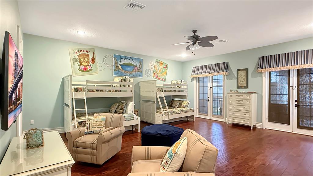 451 Muirfield Loop Reunion, FL 34747 - Photo 37 of 67 a living room with furniture and a flat screen tv