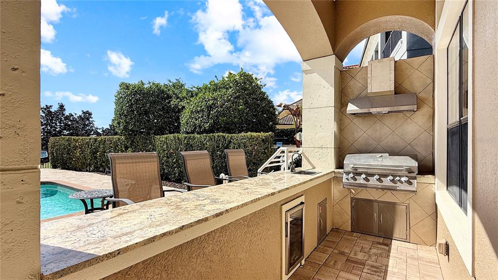 451 Muirfield Loop Reunion, FL 34747 - Photo 9 of 67 a view of a kitchen with a sink and cabinets