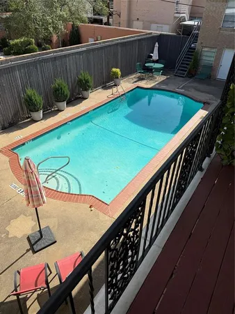 a view of a balcony with chairs