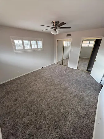 a view of an empty room and a windows