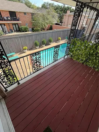 a view of balcony with wooden floor