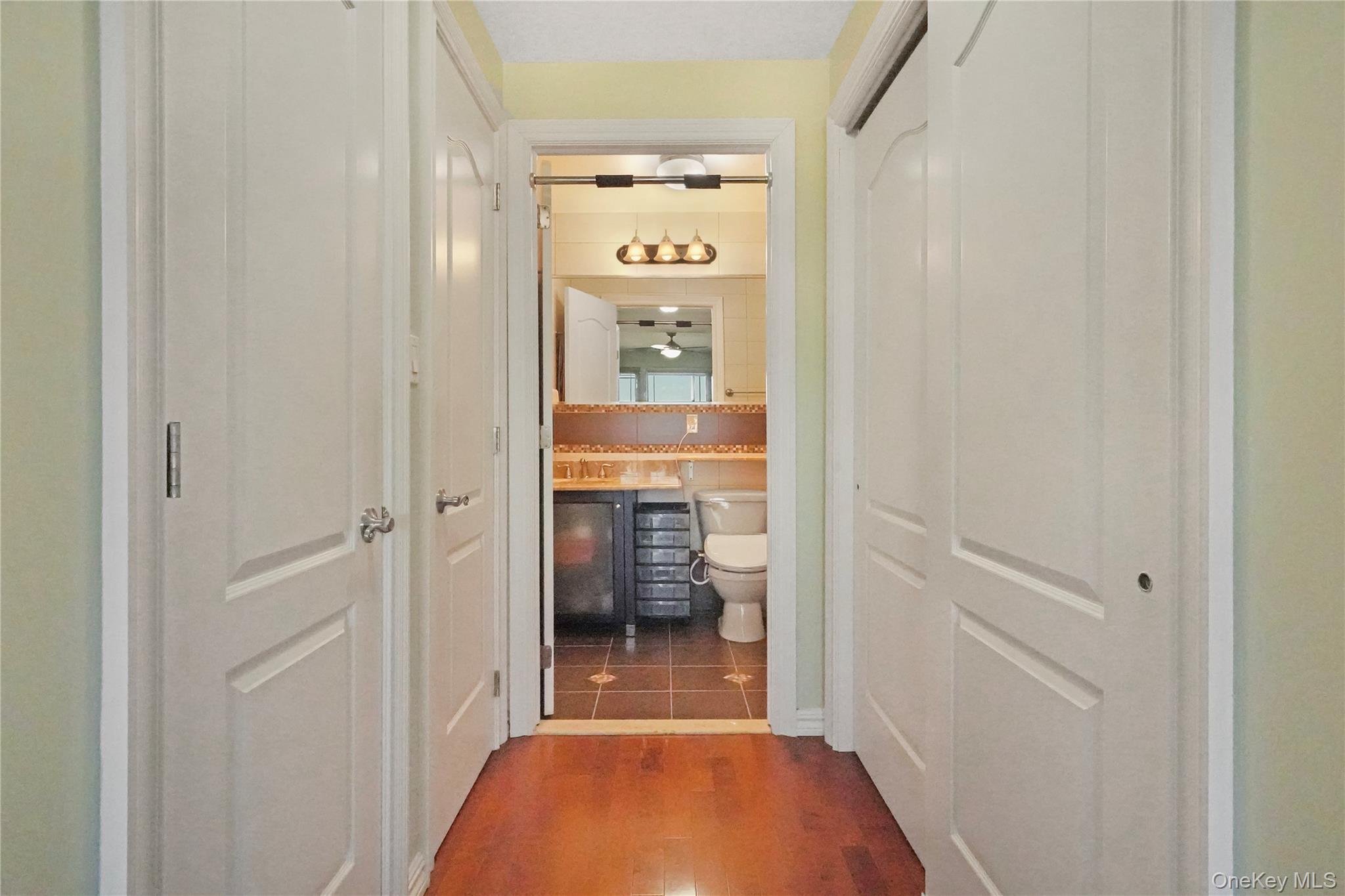 40-40 75th Street, Unit 7C Queens, NY 11373 - Photo 16 of 33 Hallway featuring dark wood-style flooring