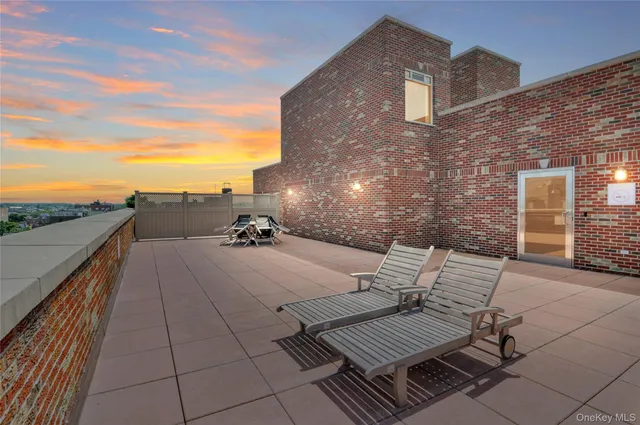 a view of a terrace with sitting area