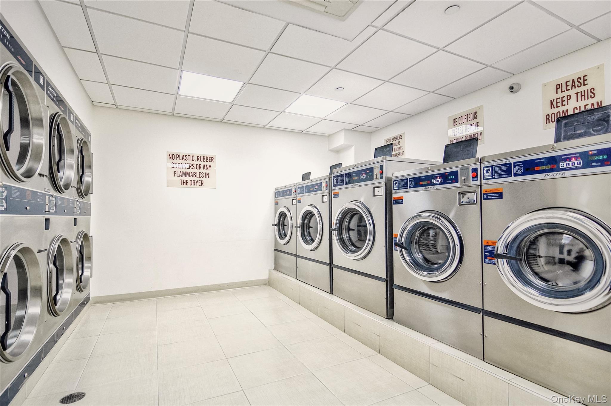 40-40 75th Street, Unit 7C Queens, NY 11373 - Photo 24 of 33 Shared laundry with a drop ceiling and separate washer and dryer