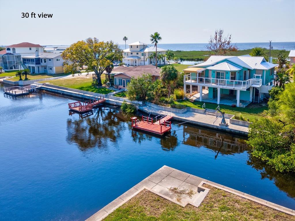 4230 Orchid Drive Hernando Beach, FL 34607 - Photo 15 of 36 a aerial view of a house with swimming pool outdoor seating