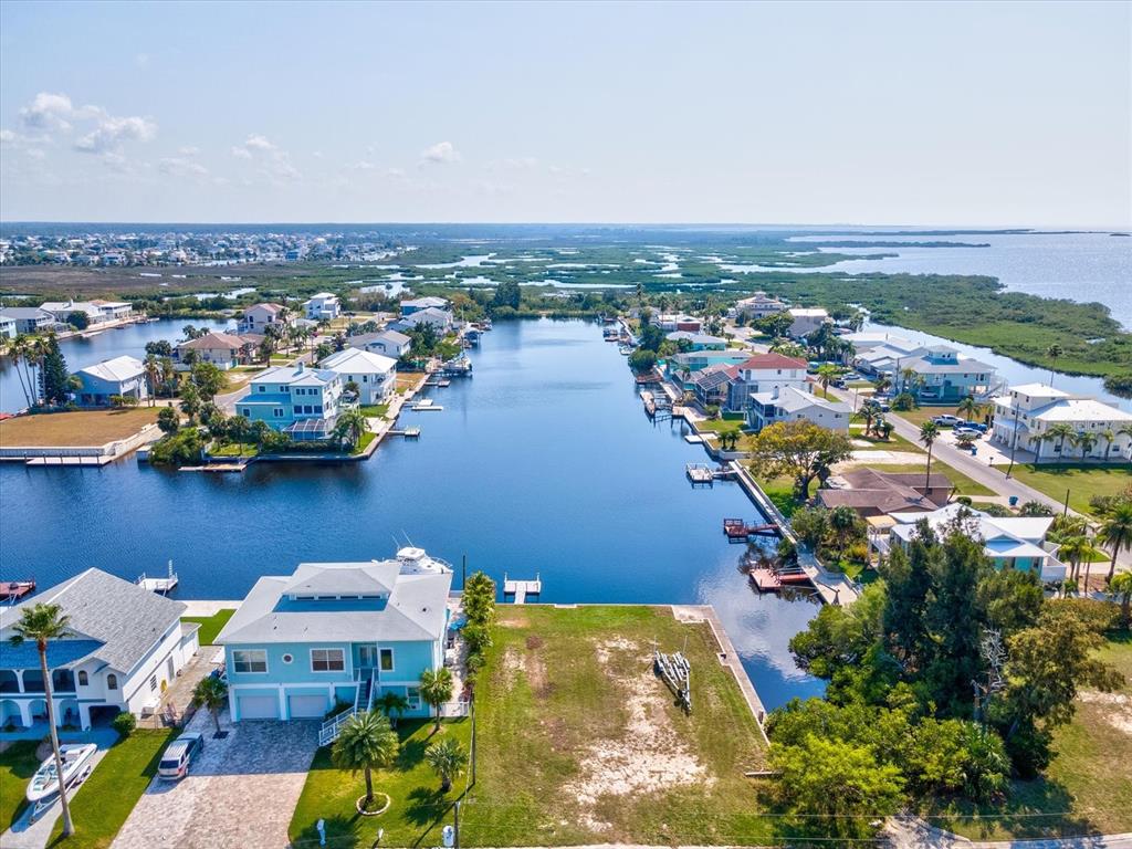 4230 Orchid Drive Hernando Beach, FL 34607 - Photo 19 of 36 an aerial view of residential houses with outdoor space