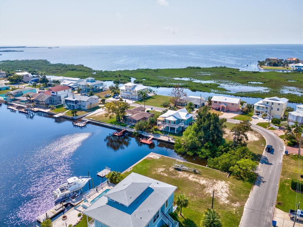 4230 Orchid Drive Hernando Beach, FL 34607 - Photo 20 of 36 an aerial view of a houses with a lake view