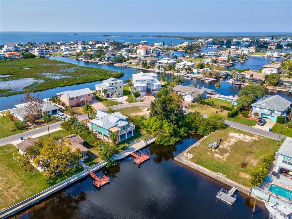 4230 Orchid Drive Hernando Beach, FL 34607 - Photo 21 of 36 an aerial view of residential houses with outdoor space and river