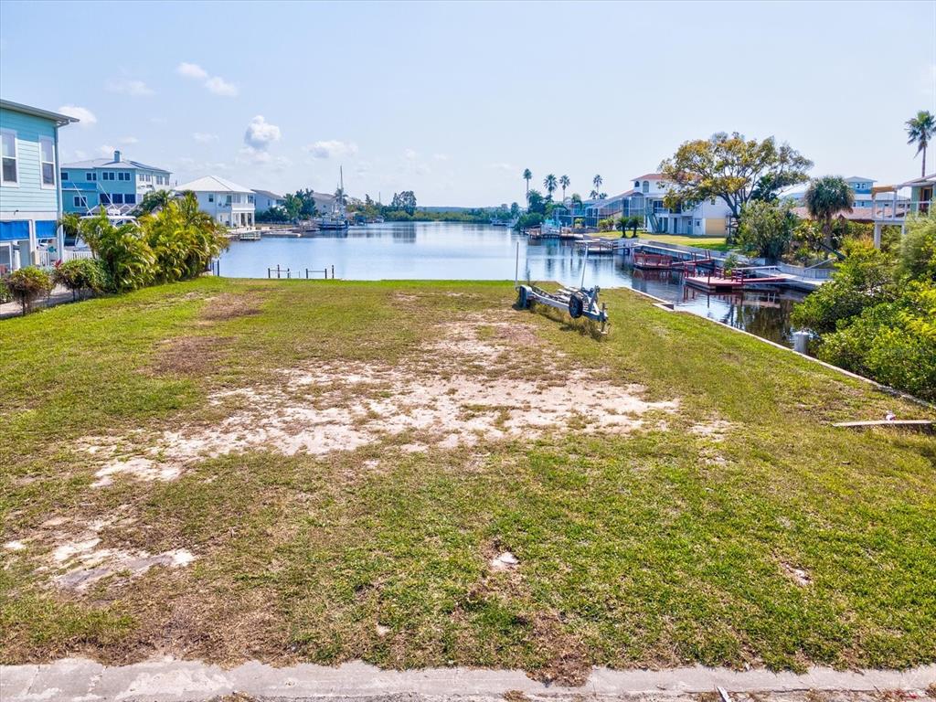 4230 Orchid Drive Hernando Beach, FL 34607 - Photo 23 of 36 a view of a swimming pool and an outdoor seating
