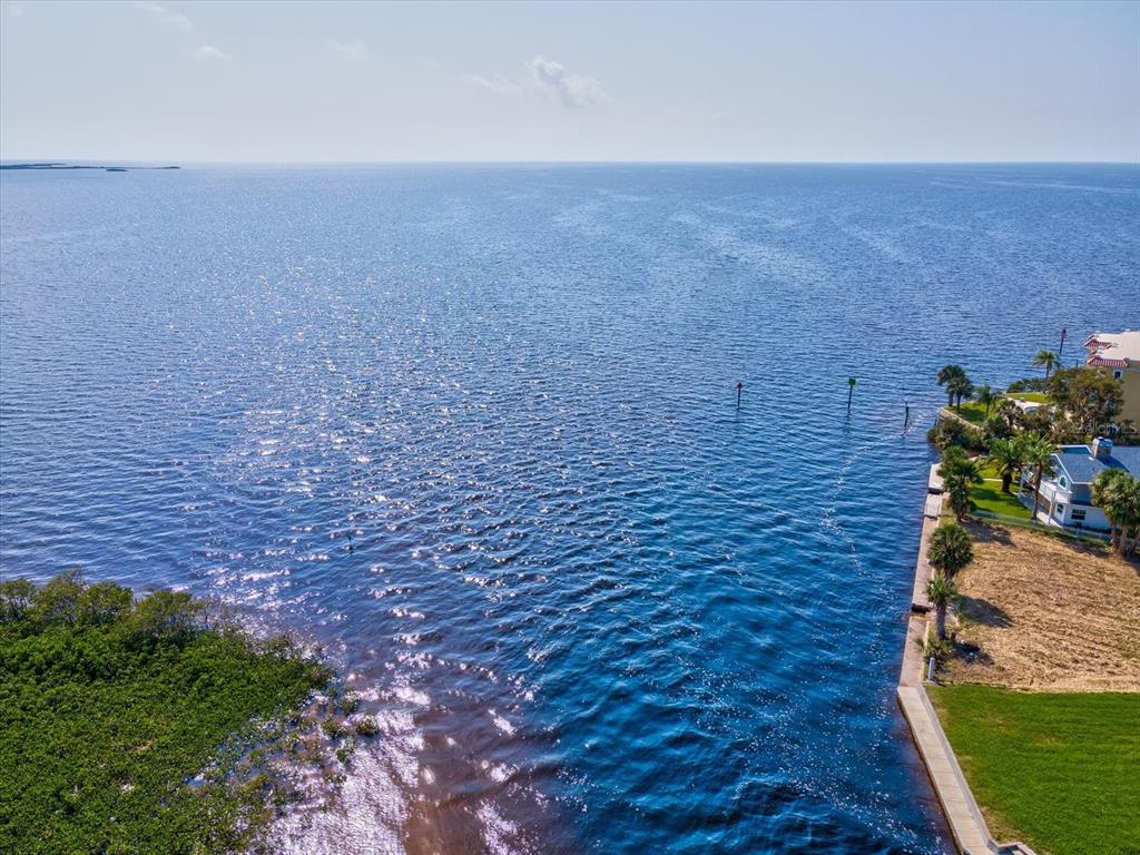 4230 Orchid Drive Hernando Beach, FL 34607 - Photo 24 of 36 a brick building with a yard