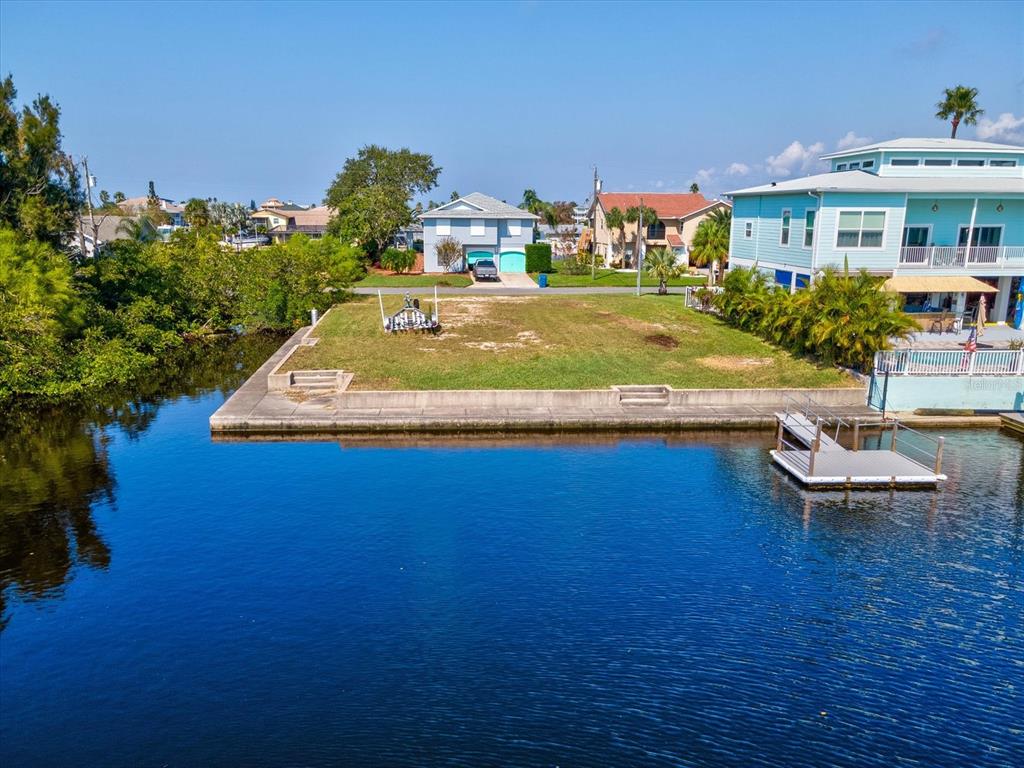 4230 Orchid Drive Hernando Beach, FL 34607 - Photo 7 of 36 an aerial view of a house with swimming pool patio and outdoor seating