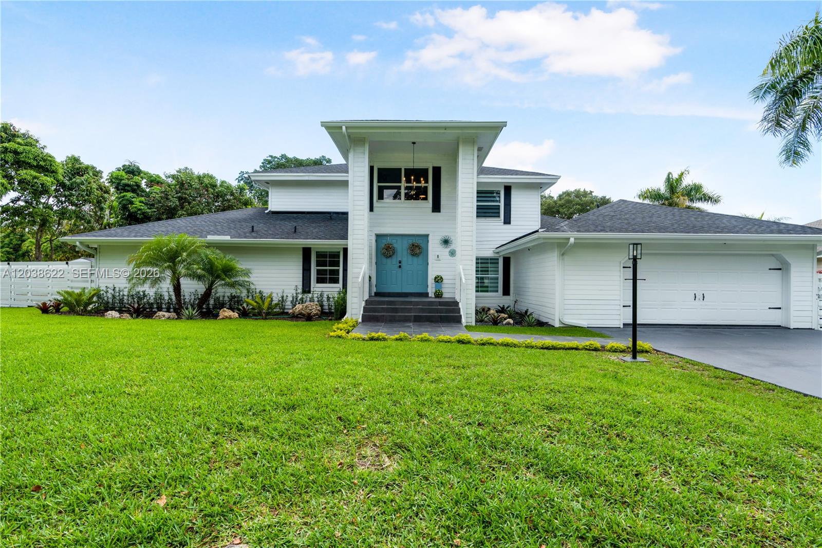 front view of a house with a yard