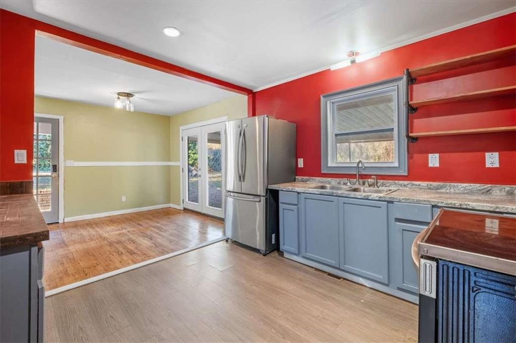 9 Atteiram Drive Rome, GA 30161 - Photo 11 of 29 a kitchen with stainless steel appliances granite countertop a refrigerator and a sink