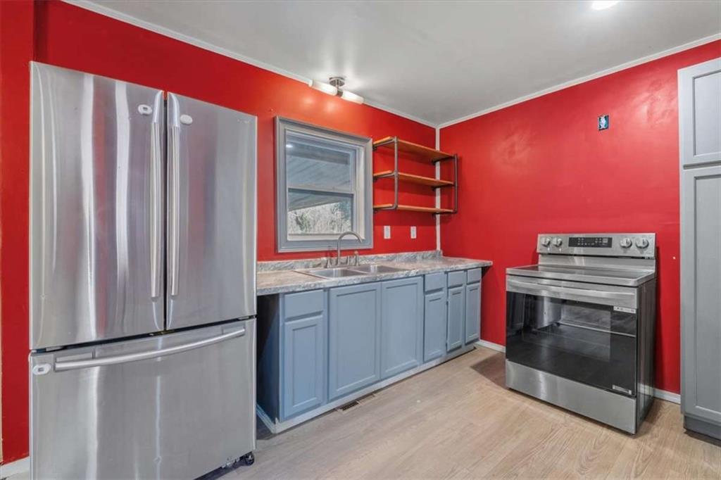 9 Atteiram Drive Rome, GA 30161 - Photo 12 of 29 a kitchen with stainless steel appliances granite countertop a refrigerator and a sink