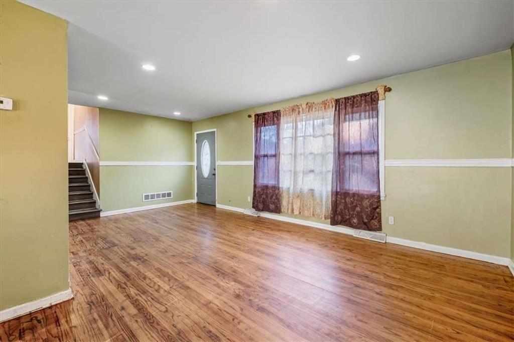 9 Atteiram Drive Rome, GA 30161 - Photo 8 of 29 a view of an empty room with wooden floor and a window