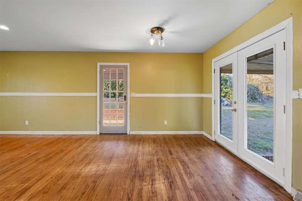 9 Atteiram Drive Rome, GA 30161 - Photo 10 of 29 a view of an empty room with wooden floor and a window