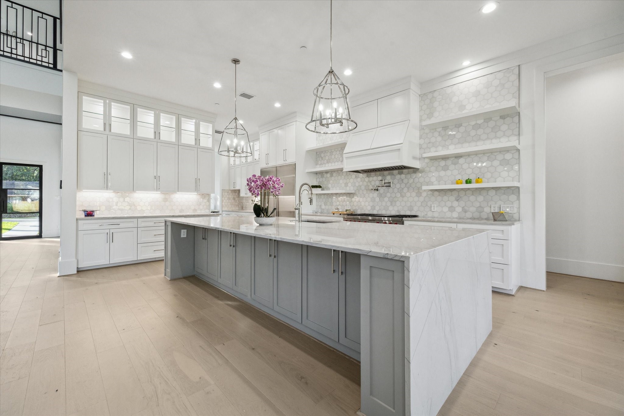534 Lanecrest Lane Houston, TX 77024 - Photo 11 of 49 a large kitchen with kitchen island a sink stainless steel appliances and cabinets
