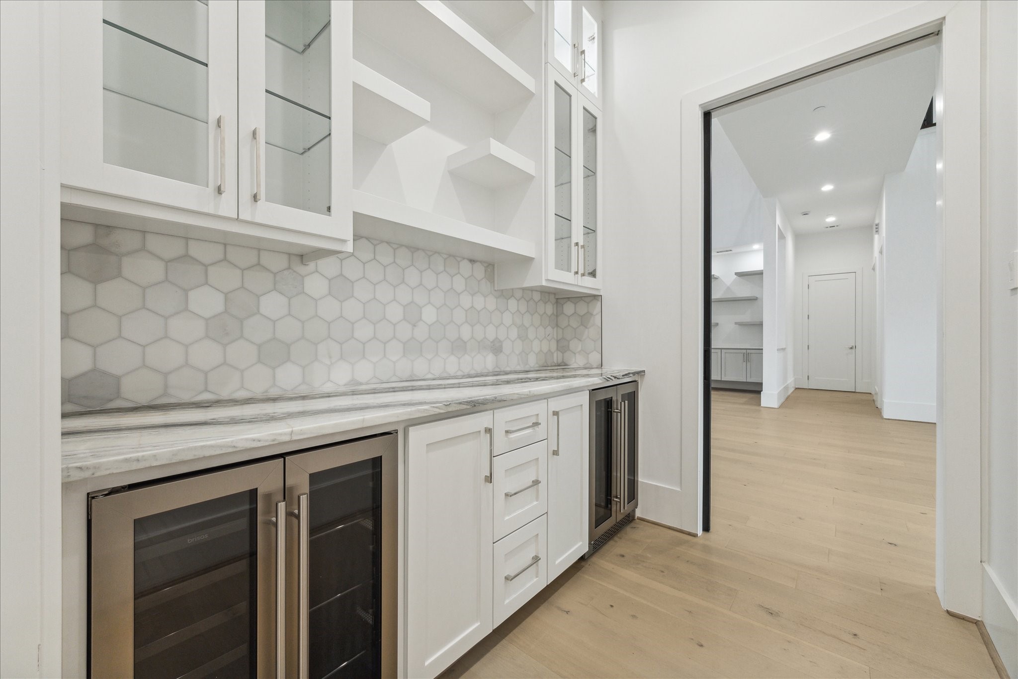 534 Lanecrest Lane Houston, TX 77024 - Photo 18 of 49 a kitchen with white cabinets and sink