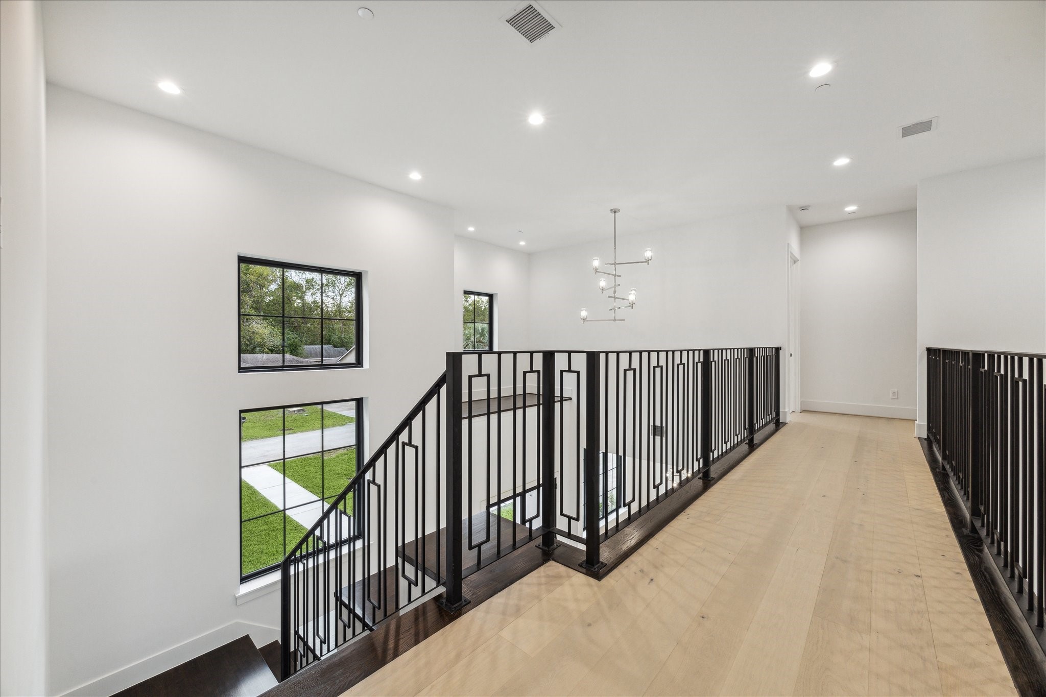 534 Lanecrest Lane Houston, TX 77024 - Photo 27 of 49 a view of staircase with wooden floor and stairs