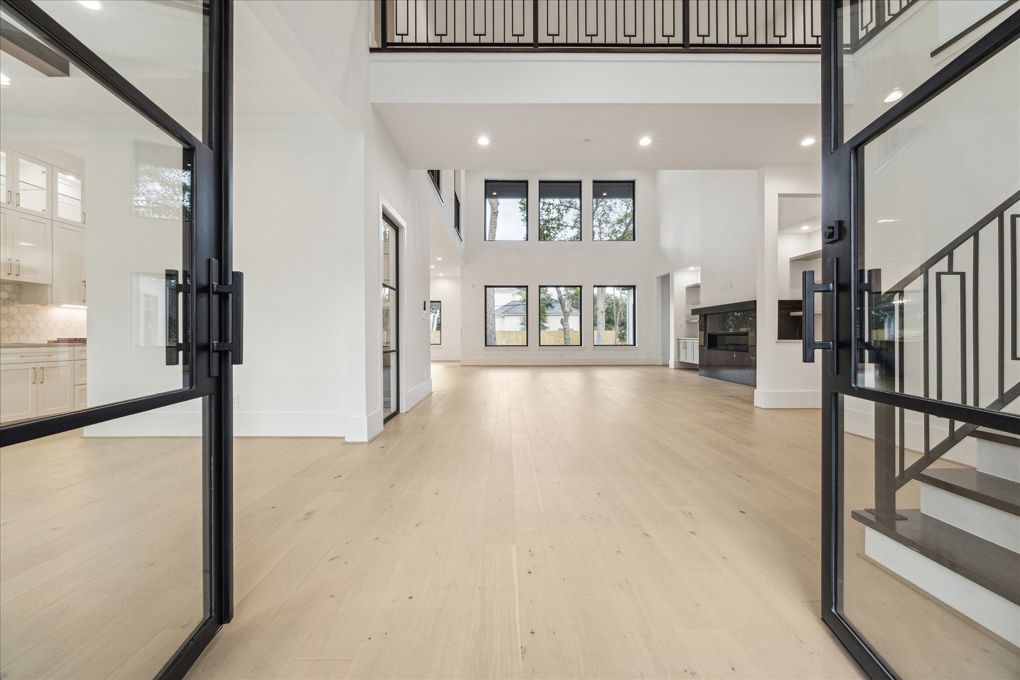 534 Lanecrest Lane Houston, TX 77024 - Photo 3 of 49 a view of an entryway with wooden floor and a livingroom