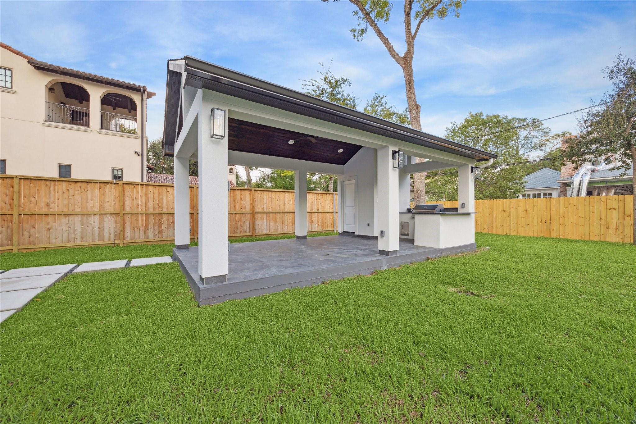 534 Lanecrest Lane Houston, TX 77024 - Photo 47 of 49 a front view of a house with a yard and porch