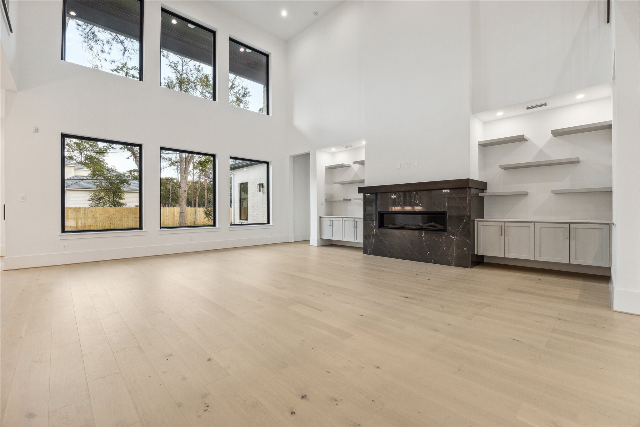 534 Lanecrest Lane Houston, TX 77024 - Photo 9 of 49 a view of an empty room with a stove and a kitchen
