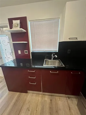 a room with a bed and a window