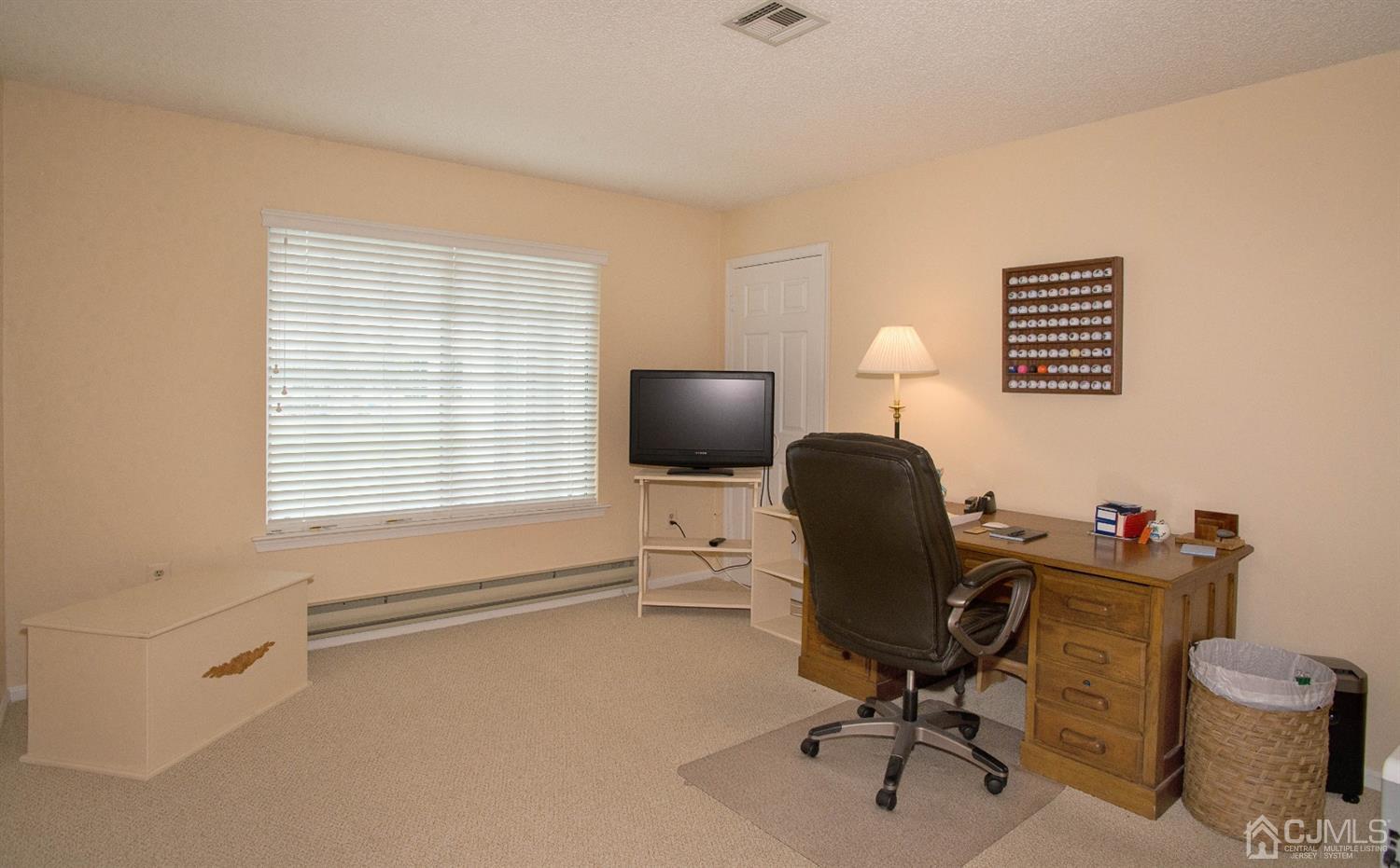 793 Pompton Road, Unit A Monroe Township, NJ 08831 - Photo 13 of 15 a view of a workspace with furniture and a window