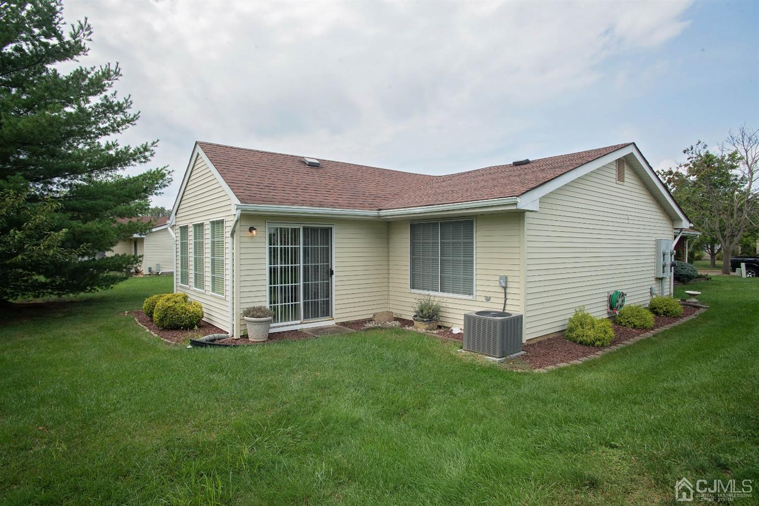 793 Pompton Road, Unit A Monroe Township, NJ 08831 - Photo 15 of 15 a front view of a house with a garden and yard