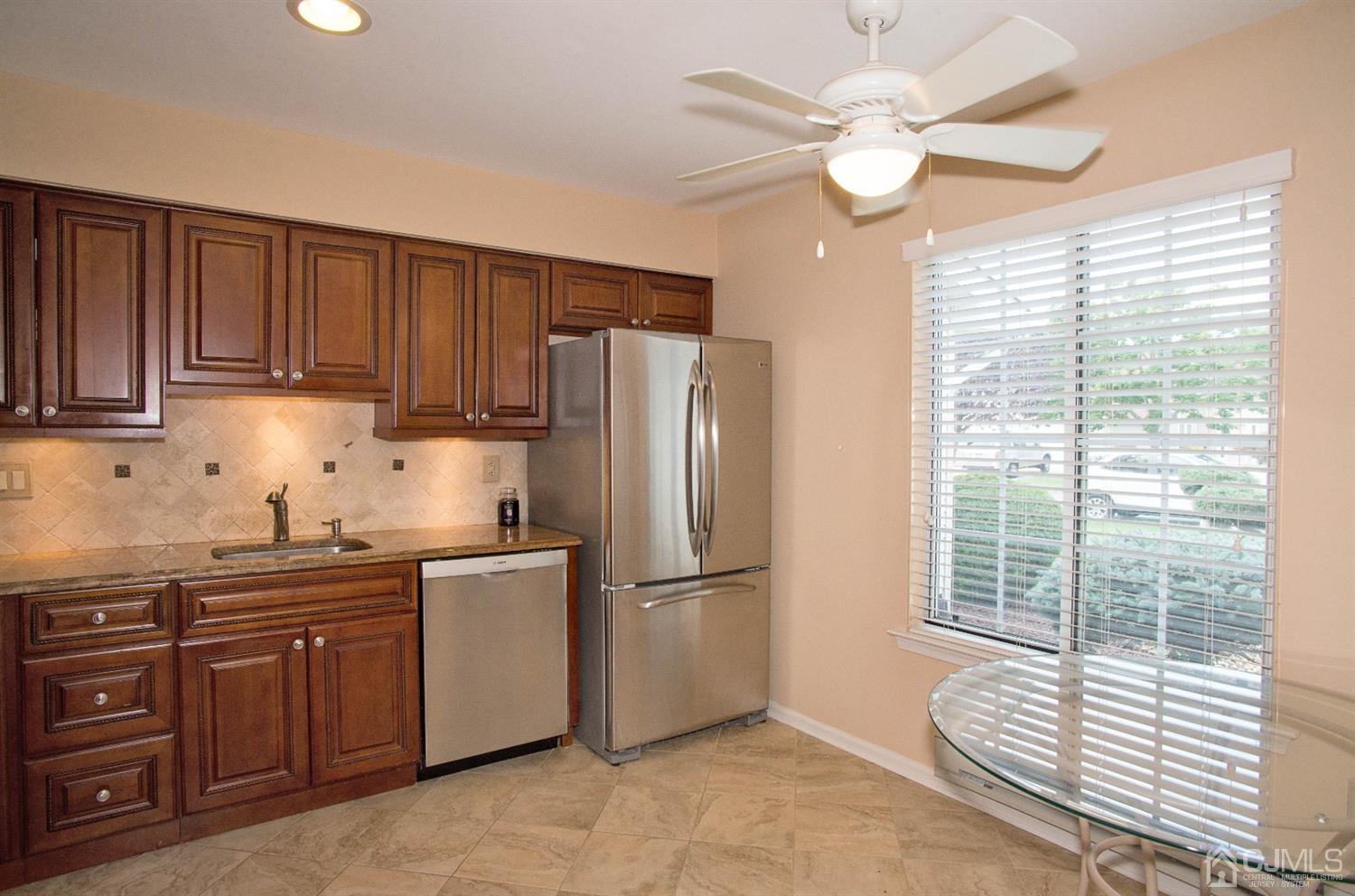 793 Pompton Road, Unit A Monroe Township, NJ 08831 - Photo 4 of 15 a kitchen with stainless steel appliances granite countertop a stove a refrigerator and a sink