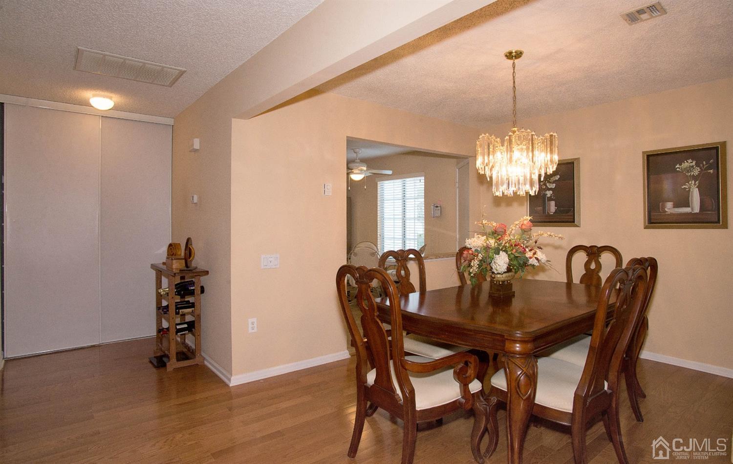 793 Pompton Road, Unit A Monroe Township, NJ 08831 - Photo 6 of 15 a view of a dining room with furniture and wooden floor