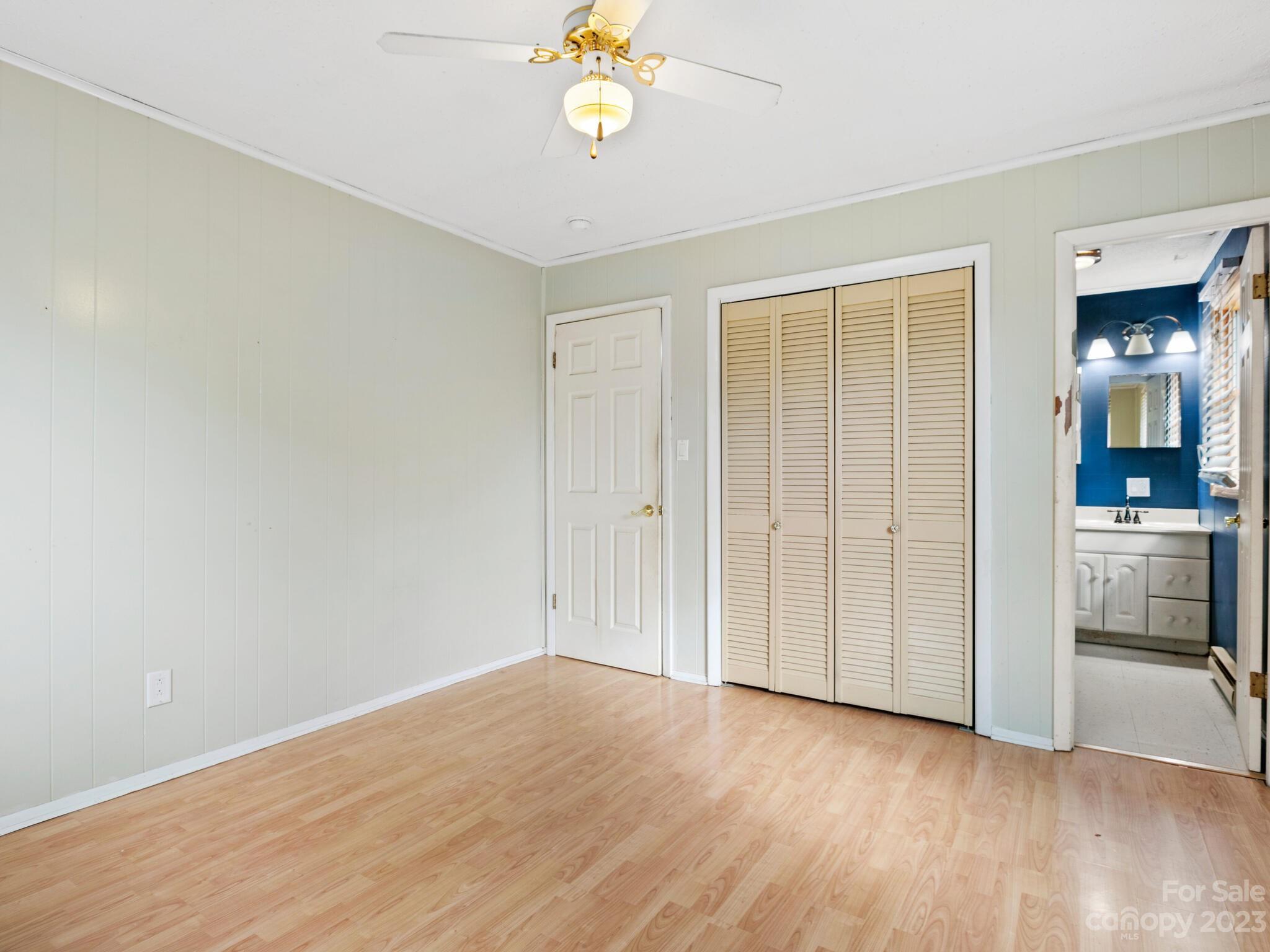 98 Pinecrest Drive Alexander, NC 28701 - Photo 11 of 32 wooden floor in an empty room with a window