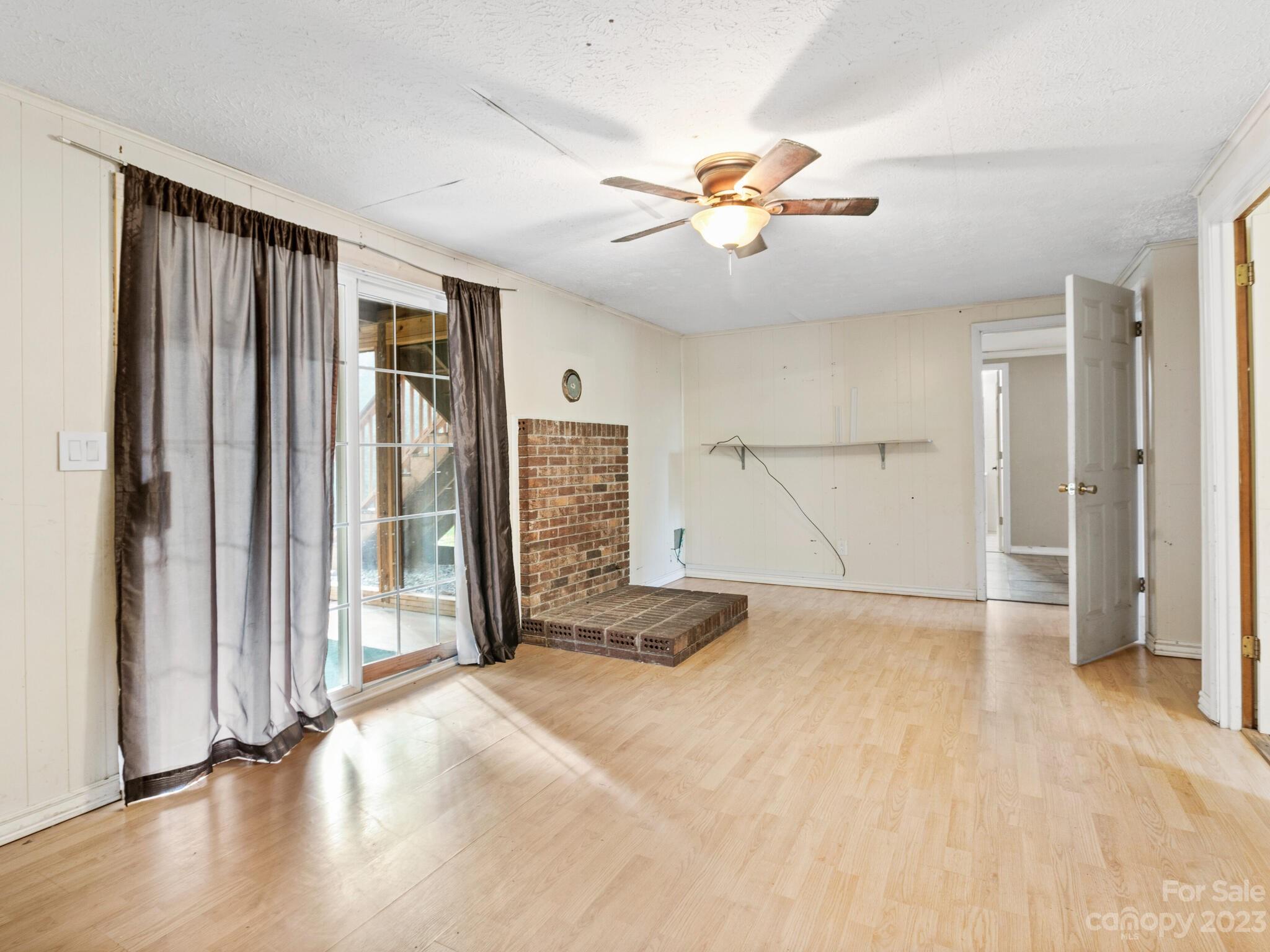 98 Pinecrest Drive Alexander, NC 28701 - Photo 18 of 32 wooden floor in an empty room with a window