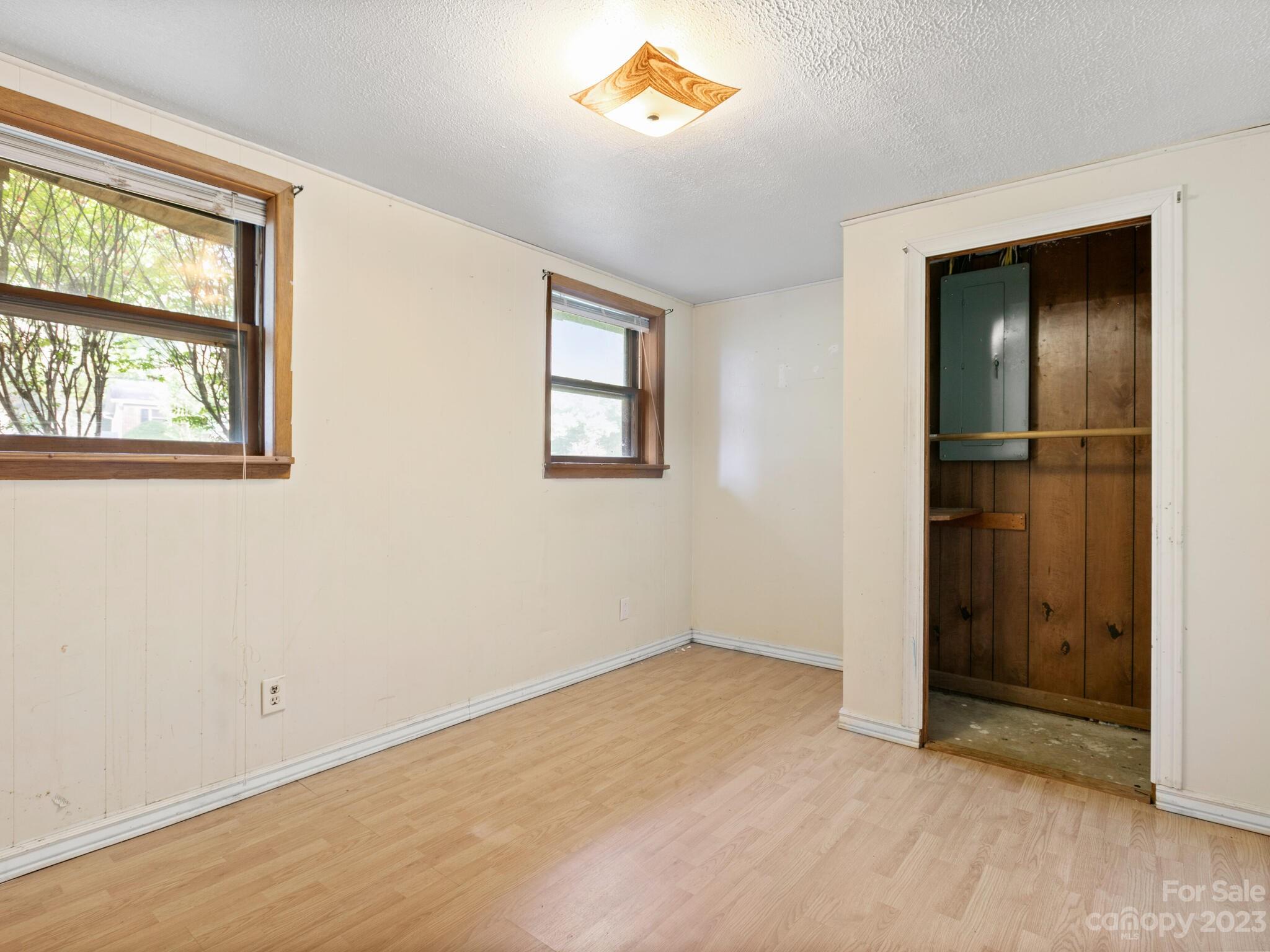 98 Pinecrest Drive Alexander, NC 28701 - Photo 19 of 32 an empty room with windows and closet