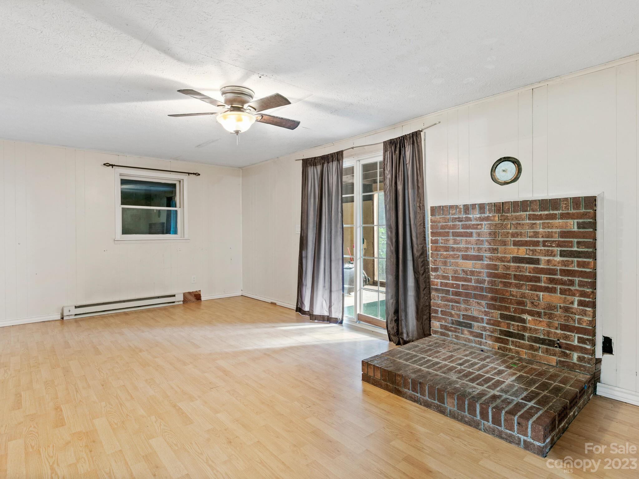 98 Pinecrest Drive Alexander, NC 28701 - Photo 20 of 32 a view of livingroom with hardwood floor and a ceiling fan