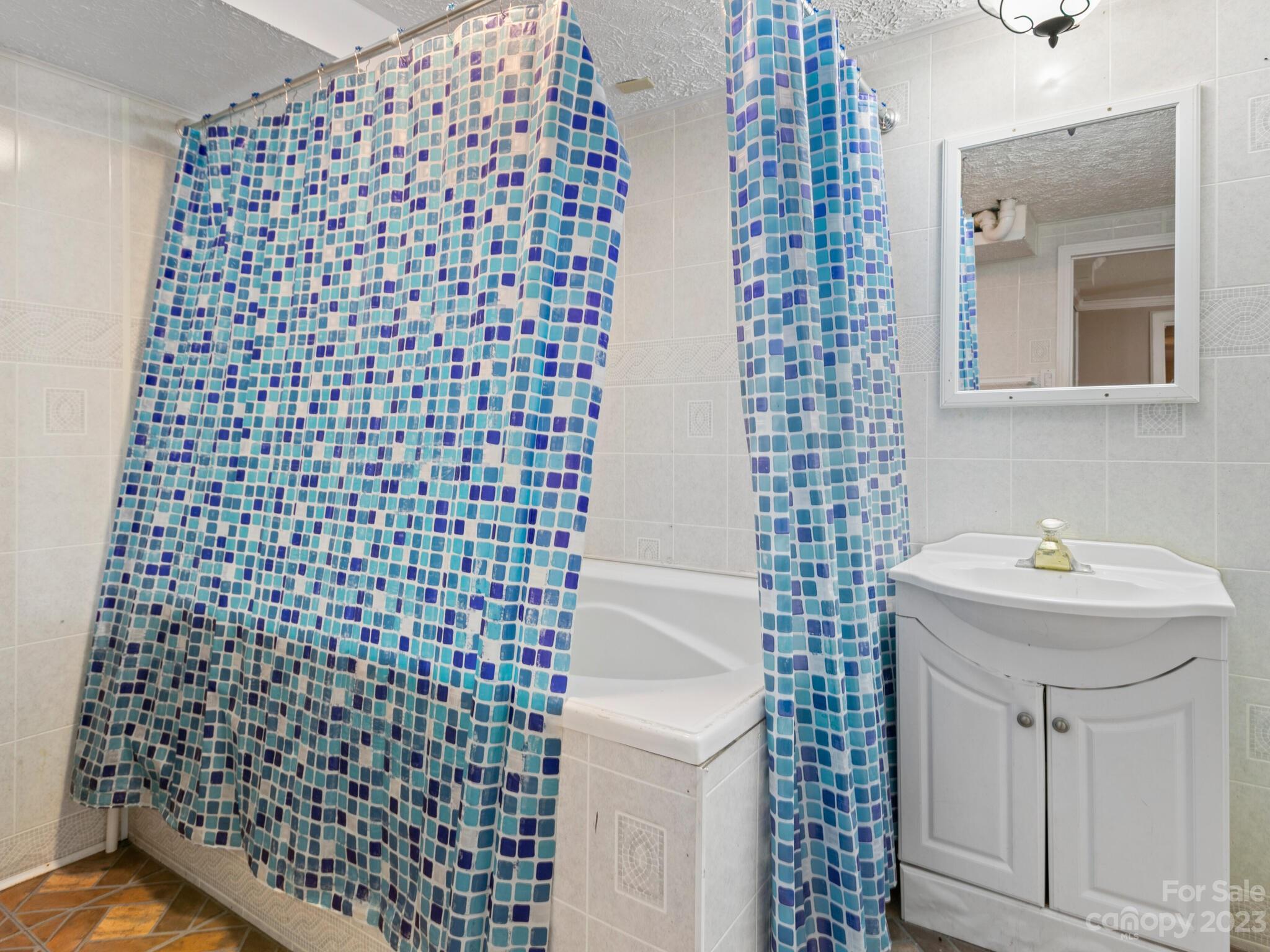 98 Pinecrest Drive Alexander, NC 28701 - Photo 21 of 32 a bathroom with a sink toilet and shower