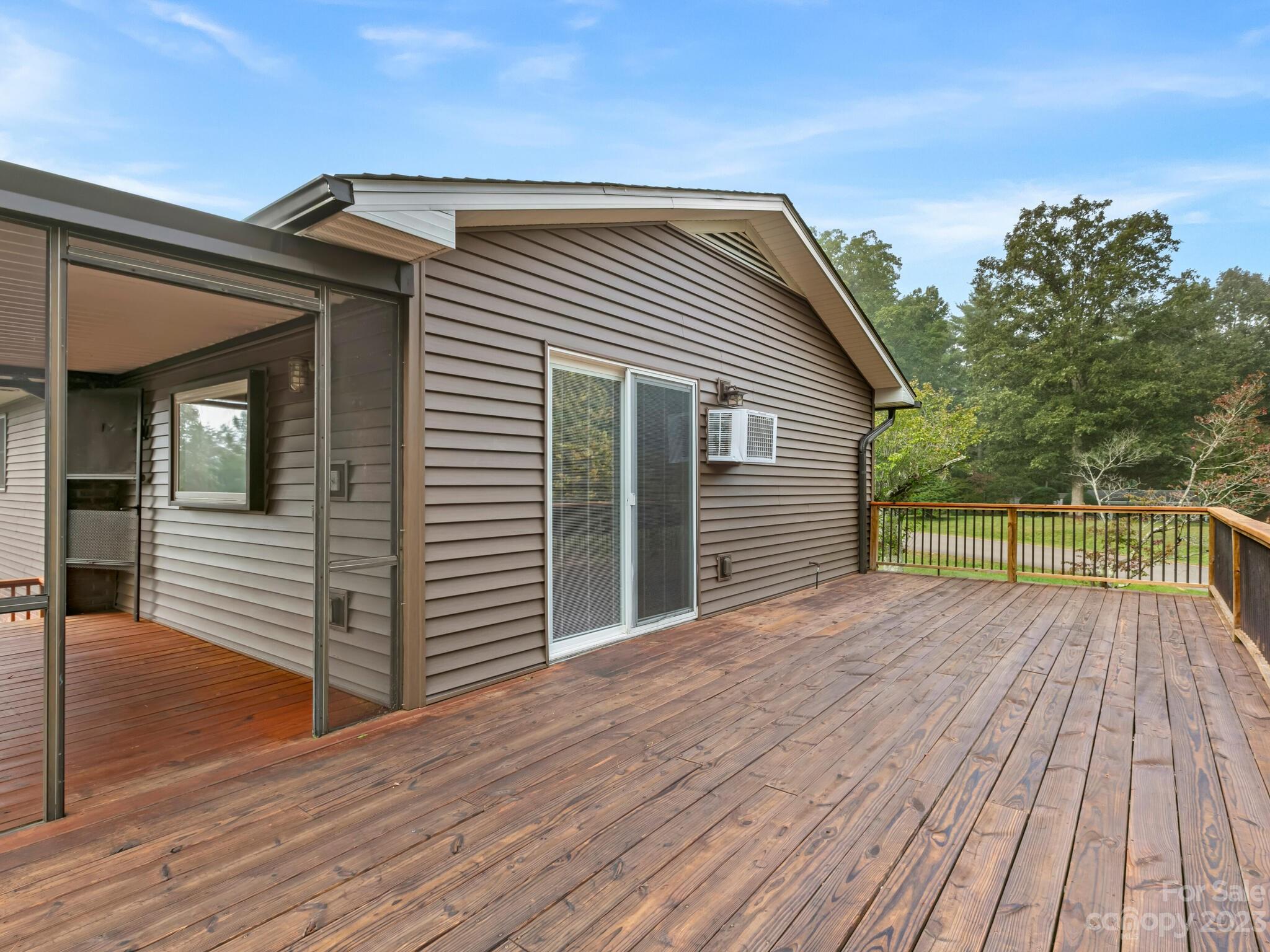 98 Pinecrest Drive Alexander, NC 28701 - Photo 26 of 32 a view of backyard with a deck and wooden floor