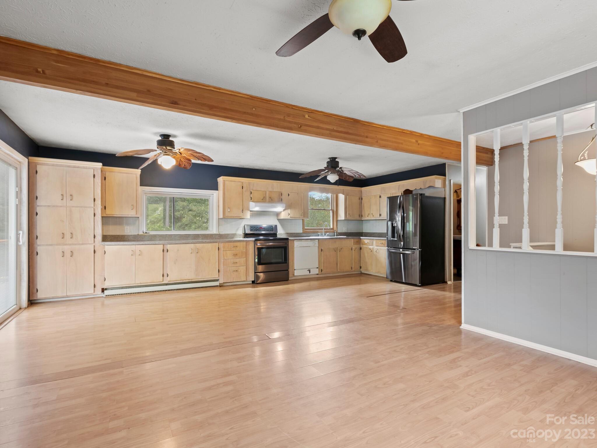 98 Pinecrest Drive Alexander, NC 28701 - Photo 6 of 32 a view of a room with kitchen appliances and windows
