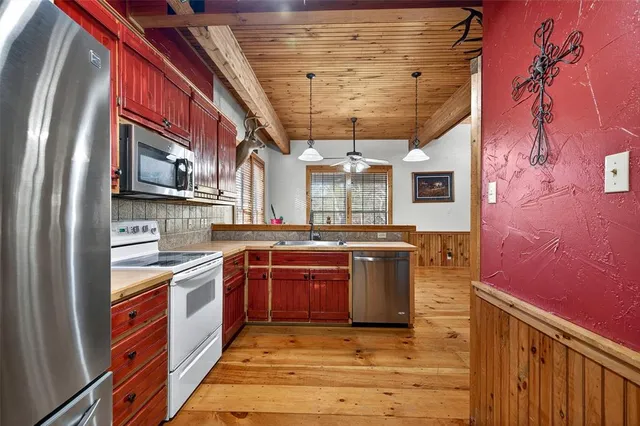 a bathroom with a sink toilet and a mirror